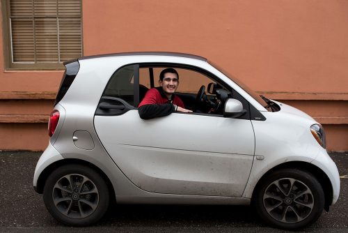 an image of the Corner Drug delivery car, a small beige colored Smart Car