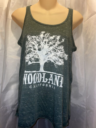 a gray tanktop with a white Woodland logo featuring a silhouette of a large tree